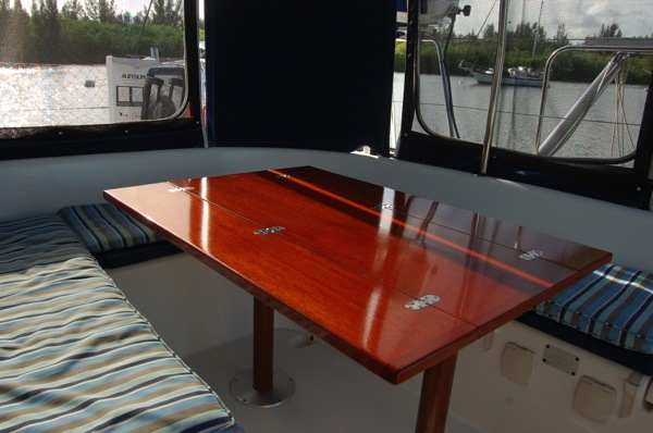Custom cockpit table with three opening positions. Can be configured for a breakfast nook, happy hour and dinner.