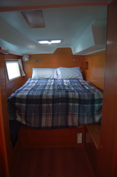 Owner's state room equipped with ample storage spaces. Includes storage beneath bed, hanging locker, two lockers with shelfs, two side lockers. Large hatch above bed, side port, and if we need it, air conditioning keeps the room cool.